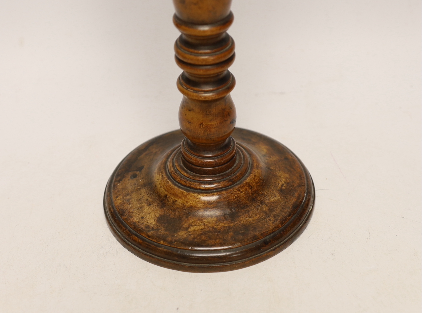 A turned maple wig stand ‘Made from the beam of the Victory of which Lord Nelson died’, 30cm